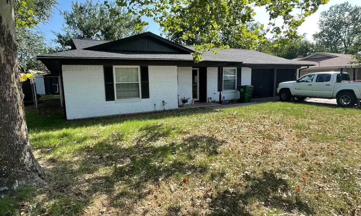 Professional roofing crew working on a residential roof in New Hempstead